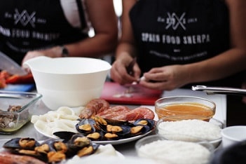 preparing seafood paella in malaga