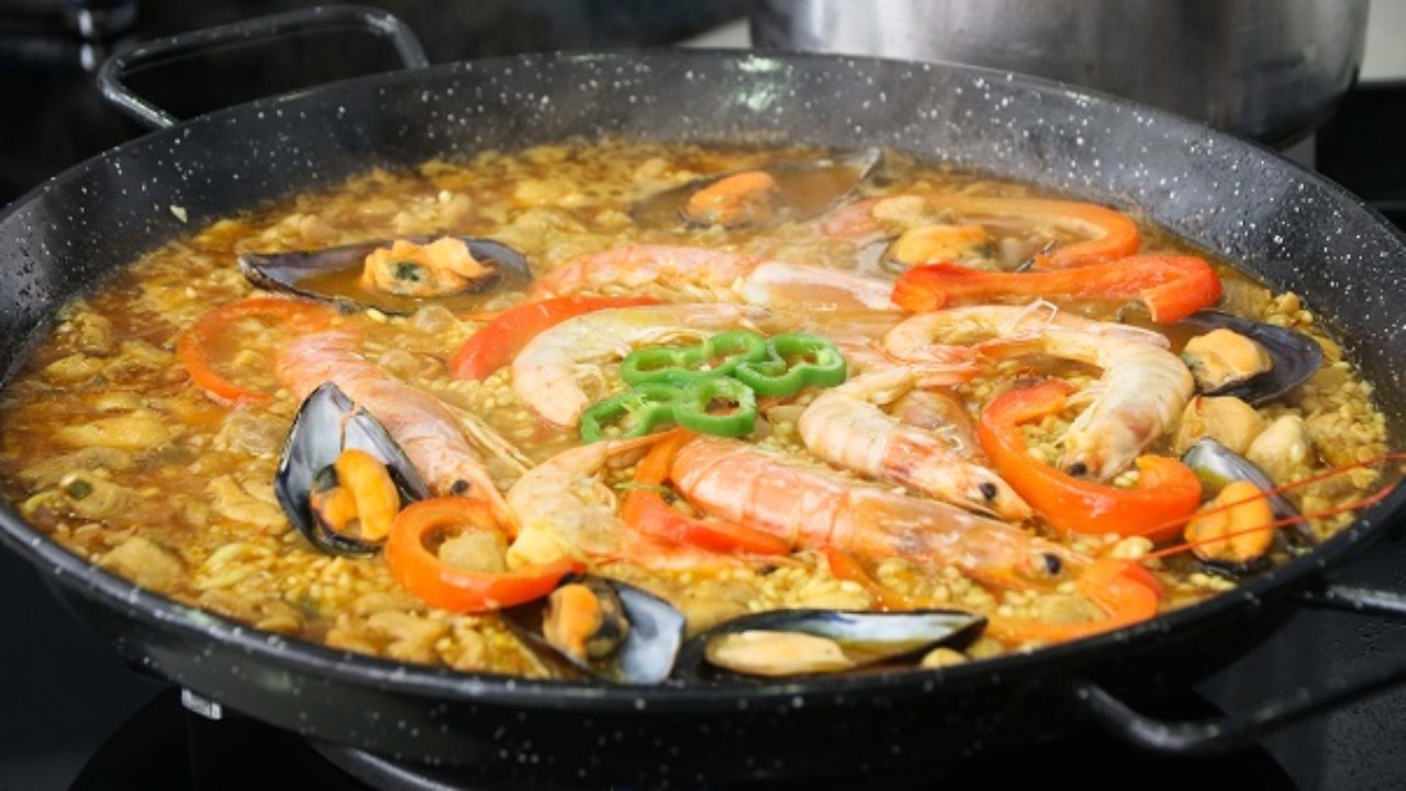 score a seafood morsel in a bite of paella the spanish seaside secret way